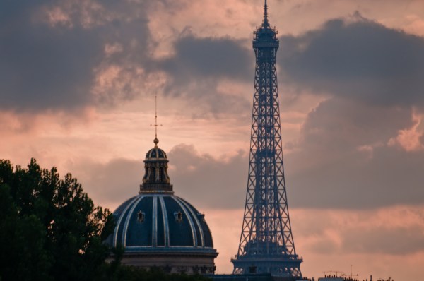 Eiffel Tower and Academie Nationale against an orange sky