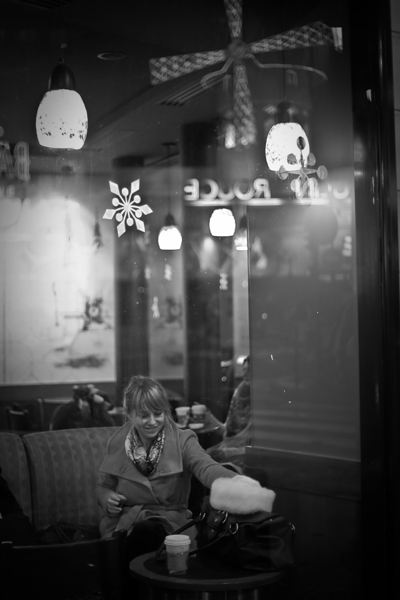 black and white photo, Cathy Kubillus sitting at starbucks